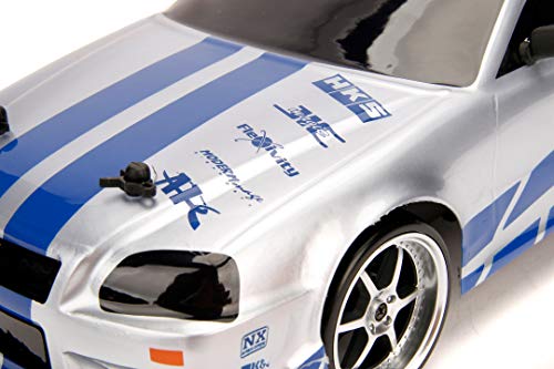 Jada Toys Fast & Furious RC Nissan Skyline GTR R34 - Coche teledirigido con Mando a Distancia, tracción a Las 4 Ruedas, función de Carga USB, Escala 1:10, Color Azul y Plateado