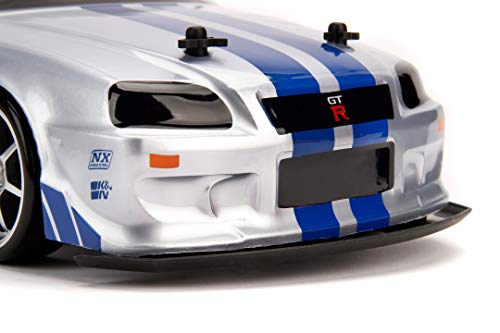 Jada Toys Fast & Furious RC Nissan Skyline GTR R34 - Coche teledirigido con Mando a Distancia, tracción a Las 4 Ruedas, función de Carga USB, Escala 1:10, Color Azul y Plateado
