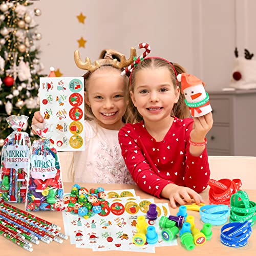 Kesote Navidad kit de 144 Decoración para niños Bolsa de Caramelo Decoración Sellos Pulseras Pegatinas y Borrador Lápices de Navidad Regalos para Niños